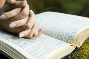 Young woman reading bible